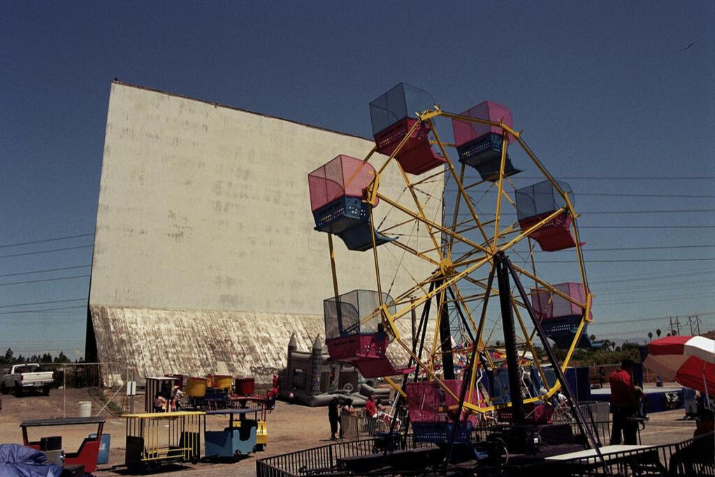 Oceanside Swapmeet - Ferris Wheel Photo of the Outdoor Oceanside Swapmeet's Ferris Wheel in front of the Old Valley Drive in Movie Screen. Photo provided by sandiego.com